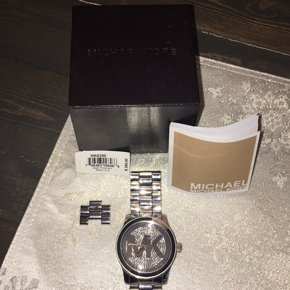 Women’s Michael Kor’s silver and diamond watch
